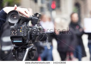 stock-photo-covering-an-event-with-a-video-camera-141143656